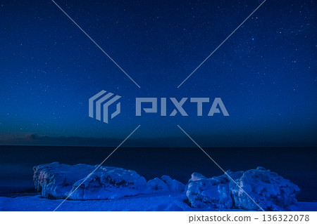 Drift ice on the coast and starry sky Drift ice on the coast and starry sky 136322078