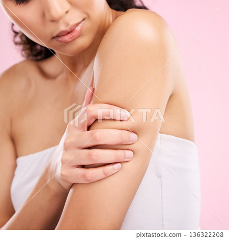 Beauty, skin care and arm of a woman in studio for dermatology, cosmetics and hygiene. Health, wellness and clean body of a female aesthetic model on a pink background for glow, shine and moisturizer 136322208