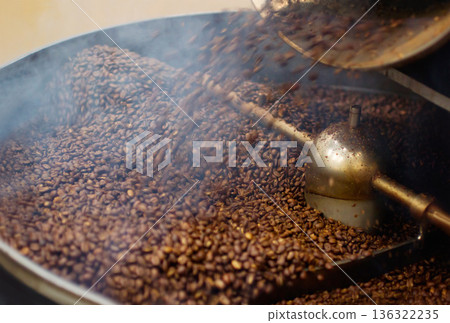 Cafe, mix and coffee beans in a machine for a raw blend, textures and steam in a pot. Food, industry and espresso and caffeine product premium grain as an export or import for trade and drink Cafe, mix and coffee beans in a machine for a raw blend, textures and steam in a pot. Food, industry and espresso and caffeine product premium grain as an export or import for trade and drink 136322235