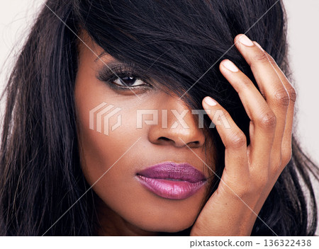 Makeup, hair and beauty on face of black woman with eyelash or hair extension in studio. Headshot of african female model with skin glow, creative lipstick and facial shine or luxury aesthetic 136322438