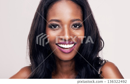Beauty, face and smile portrait of black woman in studio for makeup, cosmetics or skincare. Happy african female model on a white background for facial care, skin glow and luxury or glamour aesthetic 136322492
