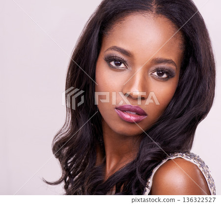 Makeup, face and beauty of a black woman in studio for cosmetics, eyelash or hair extension. Headshot of african female model on a pink background for facial skin glow and luxury or glamour aesthetic Makeup, face and beauty of a black woman in studio for cosmetics, eyelash or hair extension. Headshot of african female model on a pink background for facial skin glow and luxury or glamour aesthetic 136322527