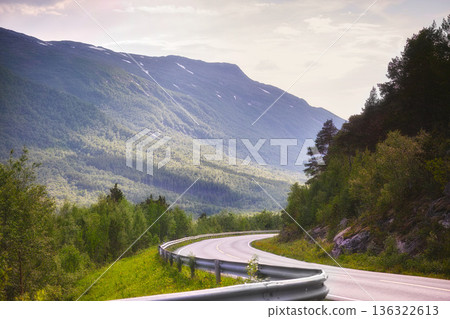 Road, mountain and travel with nature landscape, direction and destination with asphalt in Norway. Environment, street and location, journey and traveling view outdoor with horizon and countryside Road, mountain and travel with nature landscape, direction and destination with asphalt in Norway. Environment, street and location, journey and traveling view outdoor with horizon and countryside 136322613