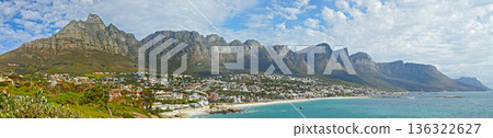 Mountain, travel and city by ocean in South Africa for tourism, traveling and global destination. Landscape, background and scenic view of beach by urban town for coastline, vacation and holiday Mountain, travel and city by ocean in South Africa for tourism, traveling and global destination. Landscape, background and scenic view of beach by urban town for coastline, vacation and holiday 136322627