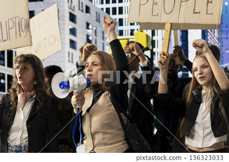 Activists taking part in a political protest near parliament building, raising awareness against corrupt politics, misconduct and scandalous government behavior. Democratic reform. 136323033