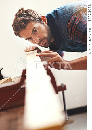 Carpenter, wood and planning with man in workshop for building, manufacturing and creative. Design, industry and woodworker with handyman measuring on workbench for builder, lumber and maintenance Carpenter, wood and planning with man in workshop for building, manufacturing and creative. Design, industry and woodworker with handyman measuring on workbench for builder, lumber and maintenance 136323038