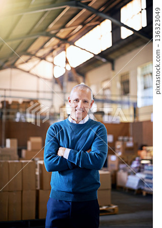 Happy, arms crossed and portrait of man in warehouse for cargo, storage and shipping. Distribution, ecommerce and logistics with employee in factory for supply chain, package or wholesale supplier Happy, arms crossed and portrait of man in warehouse for cargo, storage and shipping. Distribution, ecommerce and logistics with employee in factory for supply chain, package or wholesale supplier 136323049