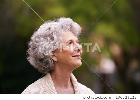 Happy senior woman, relax and thinking in nature for hope, joy or retirement in the outdoors. Face of thoughtful elderly female with smile in happiness, wonder or dream for natural life or vitality Happy senior woman, relax and thinking in nature for hope, joy or retirement in the outdoors. Face of thoughtful elderly female with smile in happiness, wonder or dream for natural life or vitality 136323122