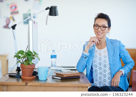 Business woman, portrait and smile at creative startup, confidence with empowerment in workplace. Confidence, success and career mindset, female professional at desk with ambition at advertising firm 136323244