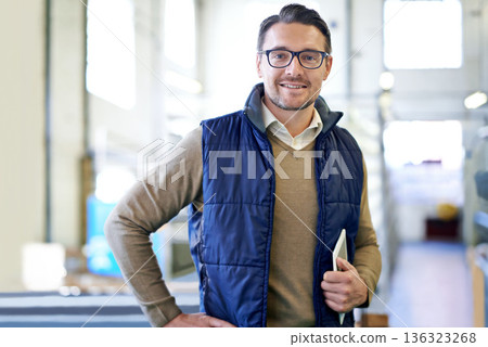 Tablet, happy and portrait of man in factory for manufacturing, networking and inventory. Distribution, industrial and technology with male employee in warehouse for inspection, export and storage Tablet, happy and portrait of man in factory for manufacturing, networking and inventory. Distribution, industrial and technology with male employee in warehouse for inspection, export and storage 136323268