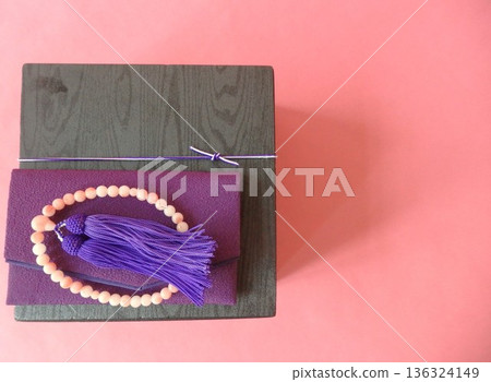 A lunch box and rosary at a memorial service A lunch box and rosary at a memorial service 136324149