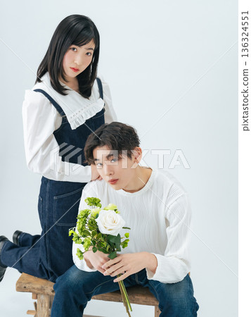 Portrait of a young man and woman wearing denim Portrait of a young man and woman wearing denim 136324551