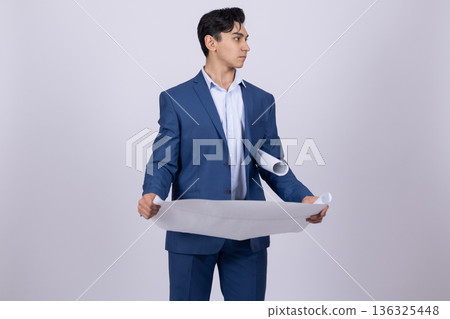 Professional engineer holding blue blueprint on white background Professional engineer holding blue blueprint on white background 136325448