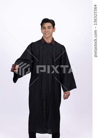 Friendly graduate student extending hand for greeting or help Friendly graduate student extending hand for greeting or help 136325564