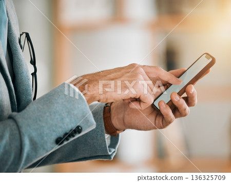 Business man, hands and phone screen at desk with networking, text and online communication. App, mobile message and social media browse in a office and workplace with contact and typing at company 136325709