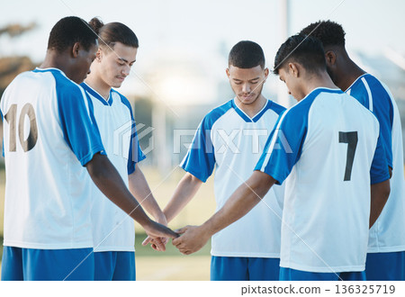 Stadium, support or soccer team praying in match for solidarity, motivation or mission in sports game. Faith unity, God or football players holding hands ready for group exercise or fitness training Stadium, support or soccer team praying in match for solidarity, motivation or mission in sports game. Faith unity, God or football players holding hands ready for group exercise or fitness training 136325719