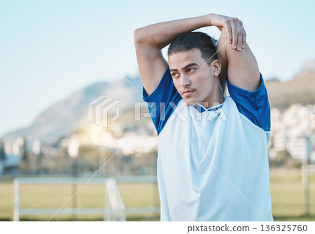 Thinking, man or soccer player stretching arms on football field in training, exercise or workout in Brazil. Fitness, warm up or male athlete ready to start practice match or sports game in stadium Thinking, man or soccer player stretching arms on football field in training, exercise or workout in Brazil. Fitness, warm up or male athlete ready to start practice match or sports game in stadium 136325760