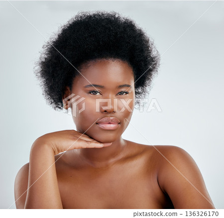 Face, beauty and skincare of black woman with hand in studio isolated on a white background. Portrait, serious and natural model with cosmetics, facial treatment or aesthetic, wellness and confident Face, beauty and skincare of black woman with hand in studio isolated on a white background. Portrait, serious and natural model with cosmetics, facial treatment or aesthetic, wellness and confident 136326170