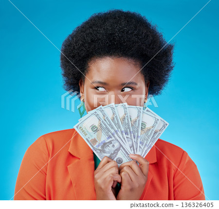 Cash, hide and a black woman lottery winner on a blue background in studio holding money for finance. Savings, investment or economy growth with a young female person excited for financial freedom Cash, hide and a black woman lottery winner on a blue background in studio holding money for finance. Savings, investment or economy growth with a young female person excited for financial freedom 136326405
