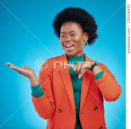 Hand, presentation and business woman with offer, choice and information for fashion, sale or opportunity. Happy african person or model pointing to palm, decision or design on blue studio background 136326435