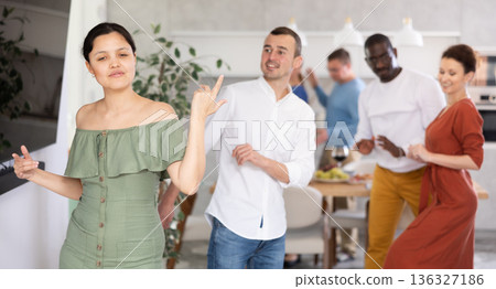 Happy middle-aged men and women doing quick dance in pairs Happy middle-aged men and women doing quick dance in pairs 136327186