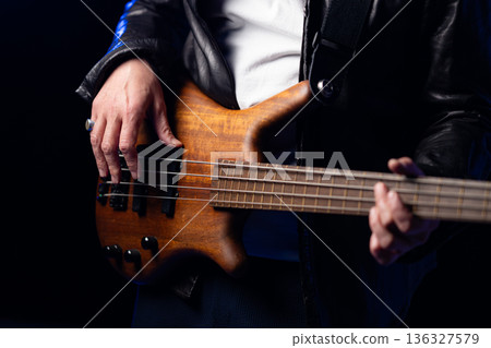 Band members performing on stage 136327579