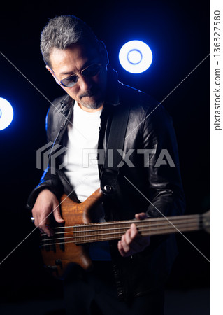 Band members performing on stage Band members performing on stage 136327580