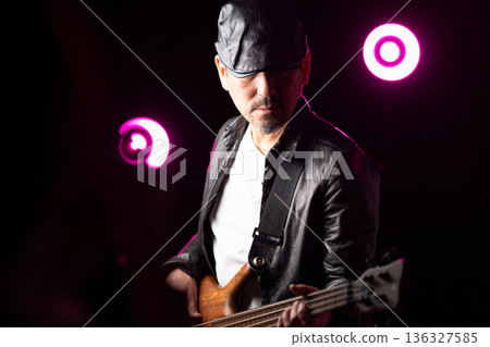 Band members performing on stage Band members performing on stage 136327585