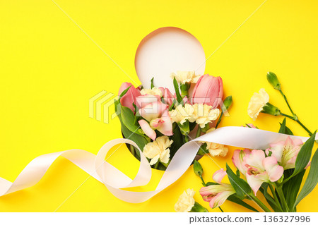 Flowers and ribbon create a joyful scene for celebrating women Flowers and ribbon create a joyful scene for celebrating women 136327996