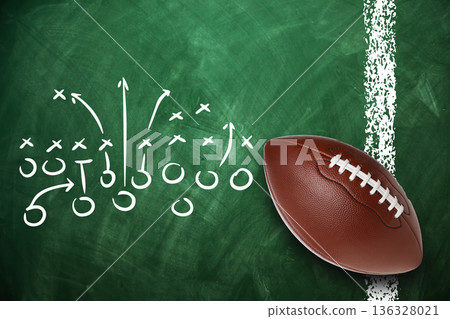 Detailed football play diagram with a ball on a chalkboard 136328021