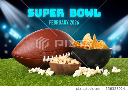 Enjoying tasty nachos and popcorn while watching the Super Bowl 136328024