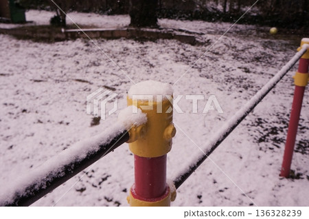 Snow-covered iron bar Snow-covered iron bar 136328239