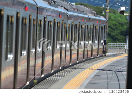 August 8, 2020, Yokohama, Kanagawa Prefecture. A familiar Keikyu Line train passes through the platform at breakneck speed. August 8, 2020, Yokohama, Kanagawa Prefecture. A familiar Keikyu Line train passes through the platform at breakneck speed. 136328406