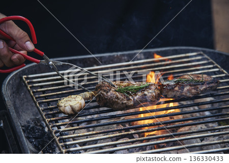 Banner BBQ Barbecue grilled meat stick on fire flame hot charcoal cooking outdoor. Banner Beef grilling picnic rib smoke bacon american cuisine. Grill pork heat bbq rack fire flame with copy space Banner BBQ Barbecue grilled meat stick on fire flame hot charcoal cooking outdoor. Banner Beef grilling picnic rib smoke bacon american cuisine. Grill pork heat bbq rack fire flame with copy space 136330433