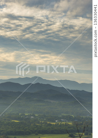 Vertical Beautiful Mountain landscape foggy windy mountain range green landscape asian farm. Vertical Amazing Landscape mountain green field meadow white cloud blue sky sunrise. Countryside scenery Vertical Beautiful Mountain landscape foggy windy mountain range green landscape asian farm. Vertical Amazing Landscape mountain green field meadow white cloud blue sky sunrise. Countryside scenery 136330441