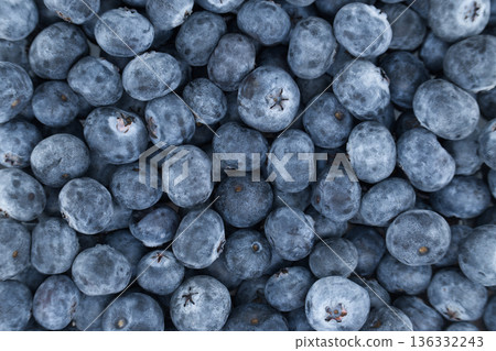 Close-up overhead view of a pile of fresh, ripe blueberries with a dusty bloom 136332243
