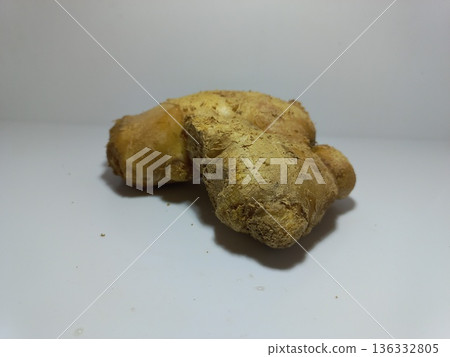 Raw Ginger Root on Clean White Surface Raw Ginger Root on Clean White Surface 136332805