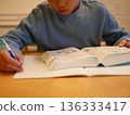 Elementary school students studying using a dictionary 136333417