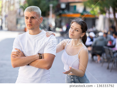 Quarrel between guy and girl during walk 136333792