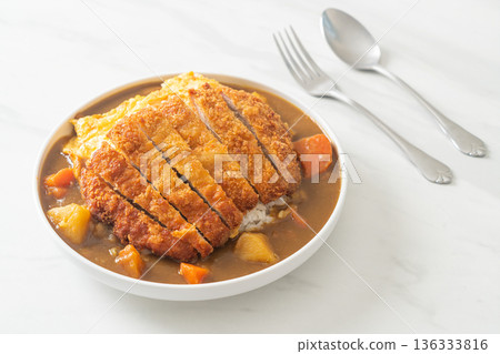 curry rice with fried pork cutlet and creamy omelet curry rice with fried pork cutlet and creamy omelet 136333816