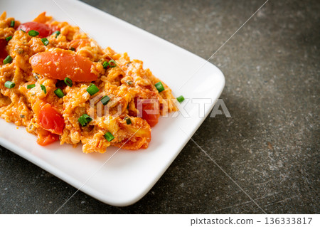 Stir-fried tomatoes with egg or Scrambled eggs with tomatoes 136333817