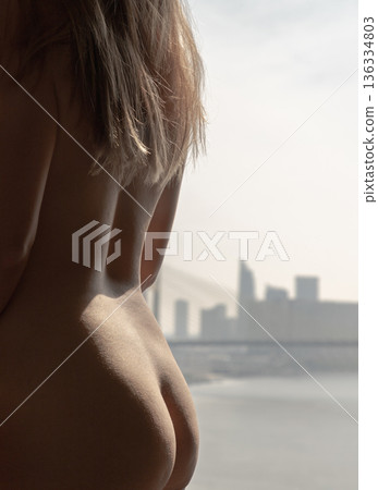 The artwork captures a woman in profile, her skin bathed in the soft glow of natural light. The warmth of the sun highlights the gentle curves of her form and the rich. The artwork captures a woman in profile, her skin bathed in the soft glow of natural light. The warmth of the sun highlights the gentle curves of her form and the rich. 136334803
