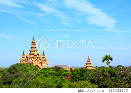 Temples in the Archaeological Zone, Bagan, Myanmar. View on ancient temple with golden roof in old city of Pagan, Burma. Topic of vacation, travel, trip abroad on vacation, cruises and tours Temples in the Archaeological Zone, Bagan, Myanmar. View on ancient temple with golden roof in old city of Pagan, Burma. Topic of vacation, travel, trip abroad on vacation, cruises and tours 136335325
