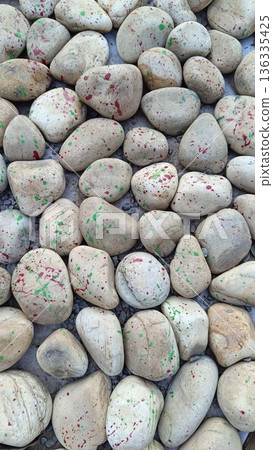 Texture of large smooth stones decoratively laid out on the ground Texture of large smooth stones decoratively laid out on the ground 136335425