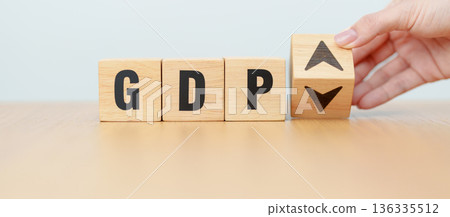 hand change wooden block with GDP text to UP and Down arrow symbol icon. Gross domestic product, Financial, Management, Economic growth, consumption, investment, government purchases and net exports 136335512