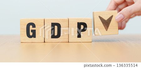 wooden block of GDP text to UP and Down arrow symbol icon. Gross domestic product, Financial, Management, Economic growth, consumption, investment, government purchases and net exports 136335514