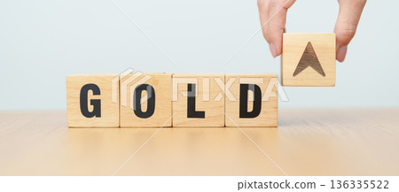 Hand change wood cube block with GOLD text to UP and Down arrow symbol icon.price, down and up, decrease and increase, cut loss, stocks, financial and economic concept Hand change wood cube block with GOLD text to UP and Down arrow symbol icon.price, down and up, decrease and increase, cut loss, stocks, financial and economic concept 136335522