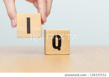 hand change wooden block from IQ to EQ, balance between intelligence quotient and emotional quotient, AQ Adversity, MQ, Moral, SQ and Social quotient concepts hand change wooden block from IQ to EQ, balance between intelligence quotient and emotional quotient, AQ Adversity, MQ, Moral, SQ and Social quotient concepts 136335552