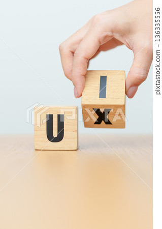 hand change wooden block from UI to UX. User Interface and User Experience, Usability, Information Architecture, IA, Research, Prototype, Testing, Onboarding, Design Thinking and Wireframe concepts hand change wooden block from UI to UX. User Interface and User Experience, Usability, Information Architecture, IA, Research, Prototype, Testing, Onboarding, Design Thinking and Wireframe concepts 136335556