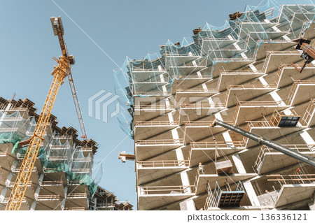 Construction of a building. Construction site with crane. Business, development, industry. Construction of a building. Construction site with crane. Business, development, industry. 136336121